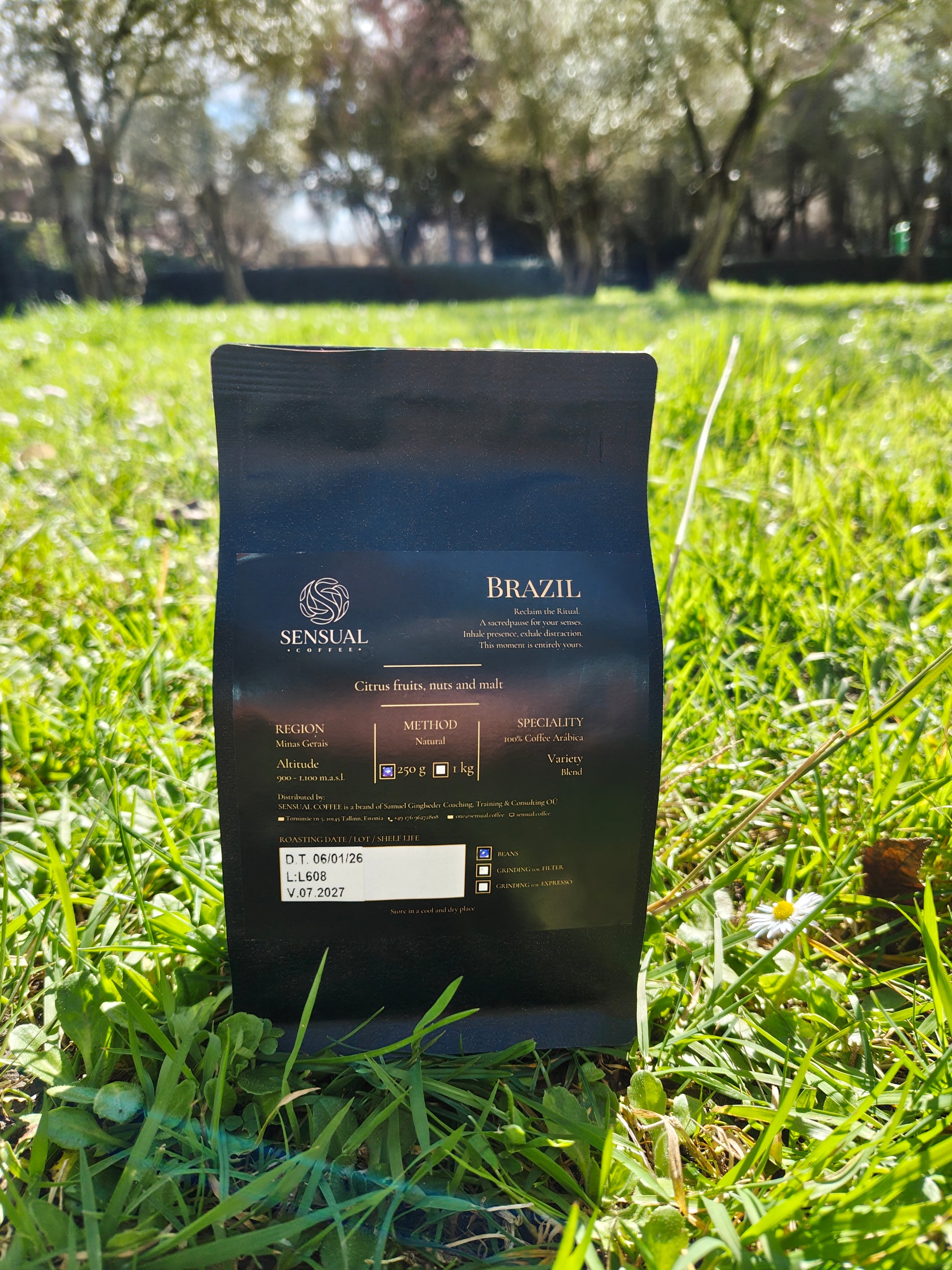 Coffee package labeled 'Brazil' on grass