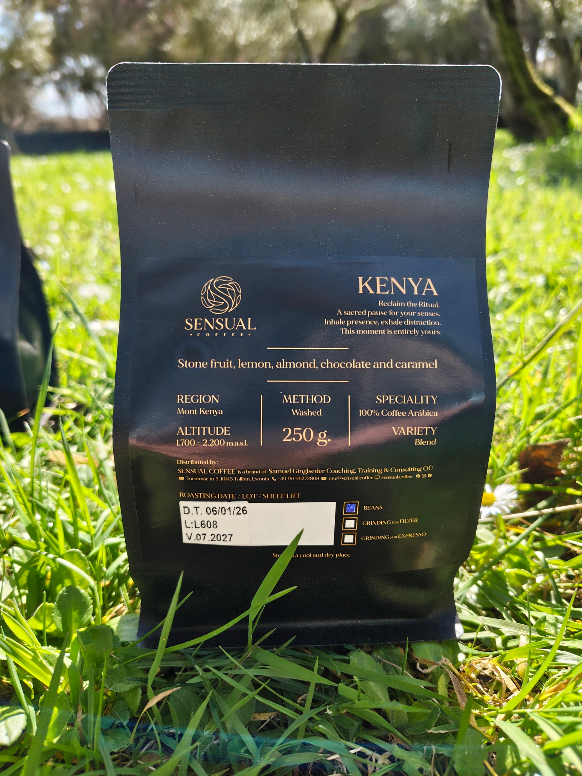 Coffee package labeled 'Sensual' on grass